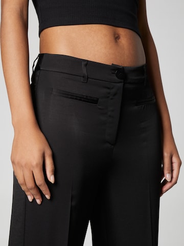 A LOT LESS Loose fit Trousers with creases 'Madlen' in Black