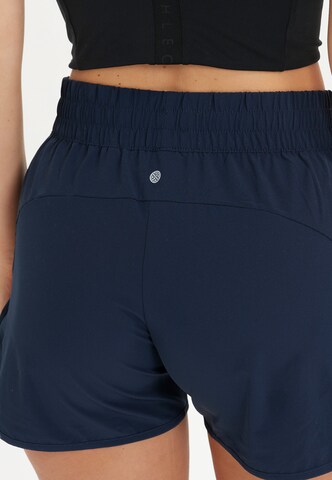 Athlecia Regular Workout Pants 'Creme' in Blue