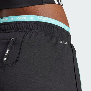 regular Pantaloni sportivi 'Own The Run' di ADIDAS PERFORMANCE in nero