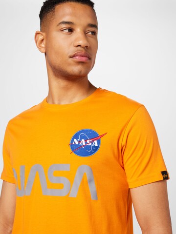 Tricou 'NASA' de la ALPHA INDUSTRIES pe portocaliu