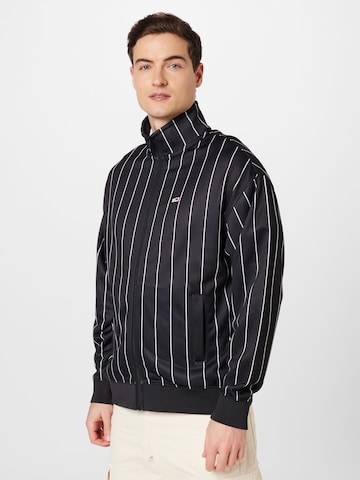 Veste de survêtement Tommy Jeans en noir : devant