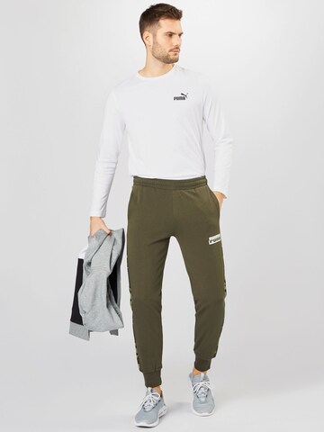 PUMA Tapered Sportbroek in Groen