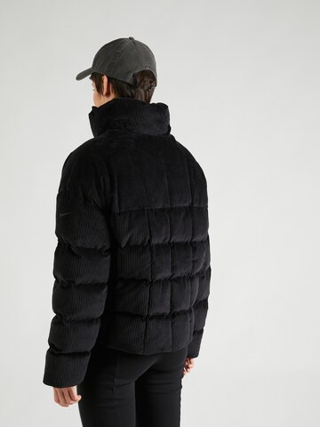 Nike Sportswear Winter Jacket 'ESSNTL PRIMA' in Black