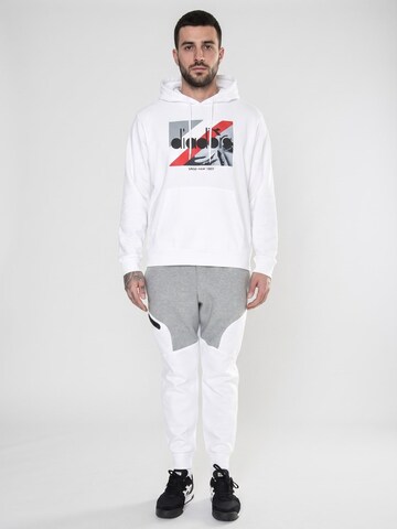 Baggy Pantalon 'UA Unstoppable Fleece Joggers Multicolored' UNDER ARMOUR en blanc