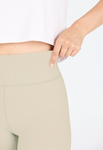 Athlecia Skinny Sports trousers 'FRANZ' in Brown