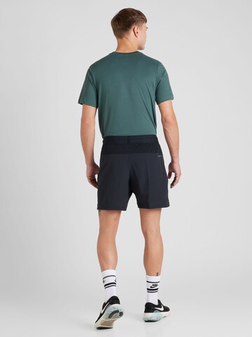 NIKE Normalny krój Spodnie sportowe 'FLEX REP 4.0' w kolorze czarny