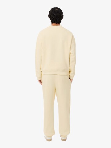 LACOSTE - Regular Calças de desporto em amarelo