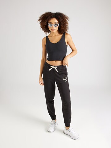 PUMA - Tapered Pantalón deportivo en negro