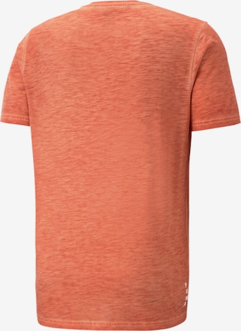 PUMA Functioneel shirt 'STUDIO FOUNDATION' in Oranje