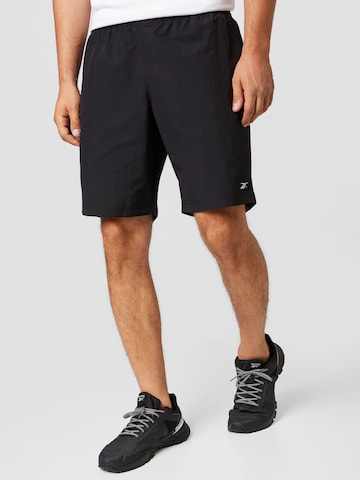 Reebok Обычный Спортивные штаны в Черный: спереди