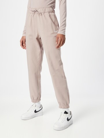 Nike Sportswear Tapered Trousers in Beige: front