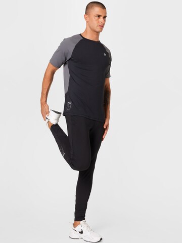 FILA Slim fit Workout Pants 'RATSCHINGS' in Black