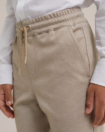 WE Fashion Slim fit Trousers in Beige