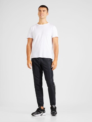 Sergio Tacchini Tapered Sporthose 'MIDDAY' in Schwarz