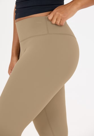 Athlecia Skinny Sports trousers 'Emarri' in Brown