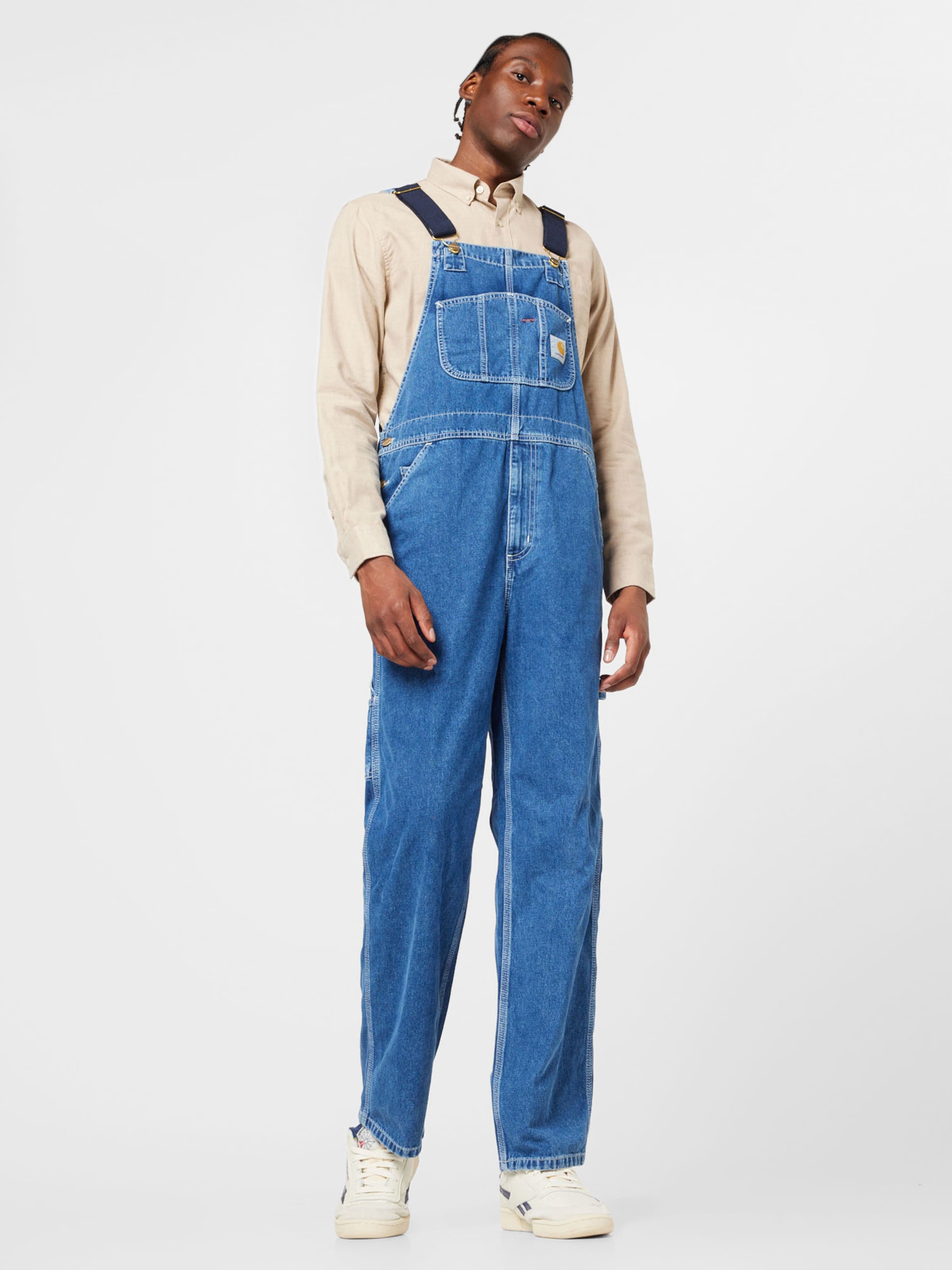Loosefit Salopette en jean Carhartt WIP en Bleu Nuit Bleu Denim ABOUT YOU