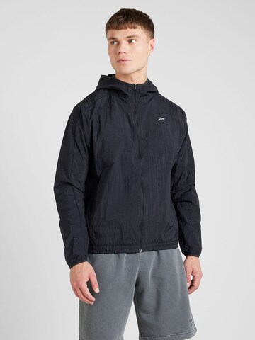 Reebok - Chaqueta deportiva en negro: frente