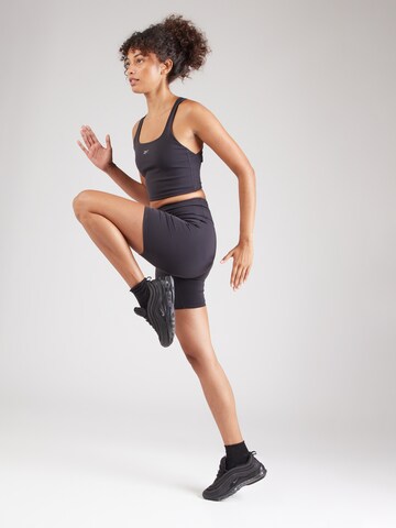 Reebok - Skinny Pantalón deportivo en negro