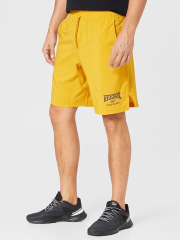 Reebok Regular Workout Pants in Yellow: front