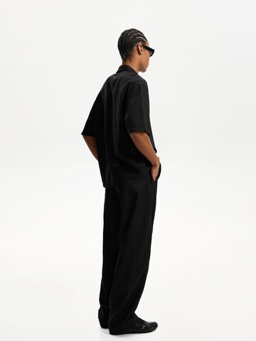 Wide leg Pantaloni di Bershka in nero
