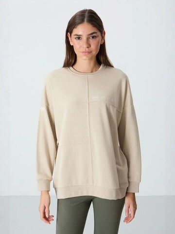 Sweat-shirt Tommy Life en beige