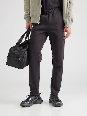 PUMA Regular Sportbroek 'EVOSTRIPE' in Zwart: voorkant