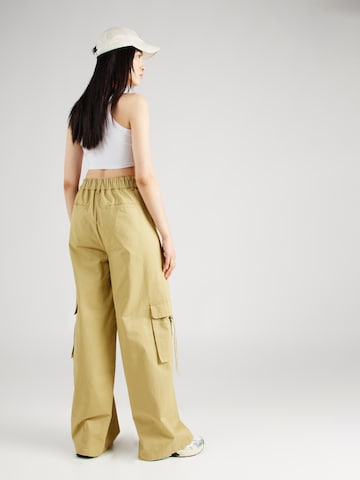 Karo Kauer Wide leg Pleat-front trousers in Green