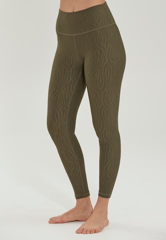 Athlecia Slim fit Workout Pants 'Alma' in Green: front