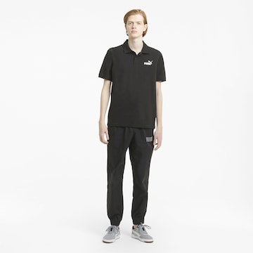 PUMA Poloshirt 'Essentials' in Schwarz