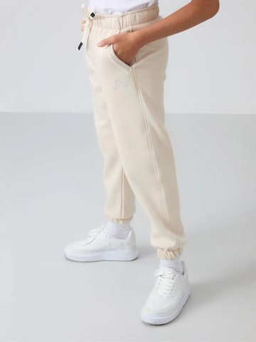 Tommy Life Broek 'TOMMY Kinder Jogginghose' in Beige