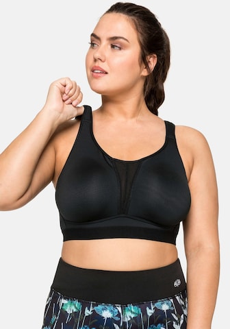 SHEEGO Bralette Sports Bra in Black: front