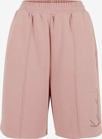 Karl Kani Normalny krój Spodnie w kolorze różowy: przód