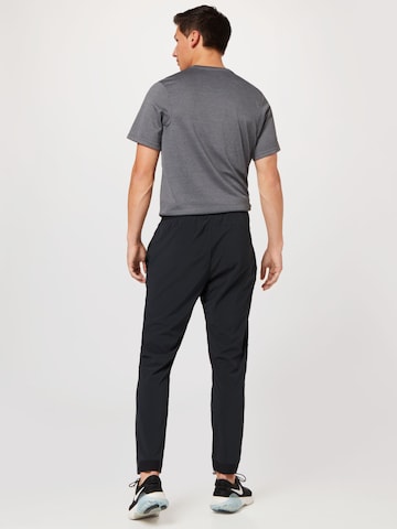 NIKE Regular Workout Pants in Black