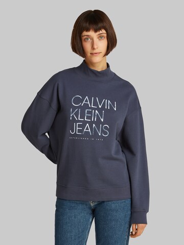 Sweat-shirt Calvin Klein Jeans en bleu : devant