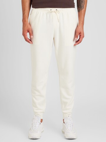 NIKE Tapered Sportbroek 'PRIMARY' in Beige: voorkant