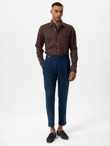 Tapered Pantaloni cutați de la Antioch pe albastru