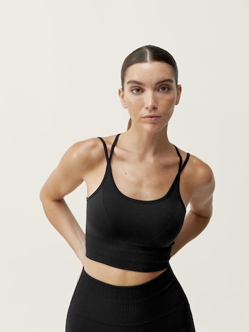 Born Living Yoga Sports Top 'Dana' in Black: front