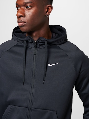 NIKE - Sudadera con cremallera deportiva en negro