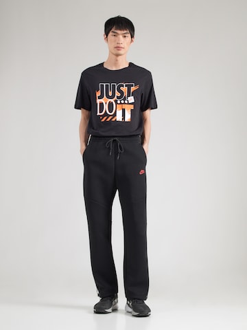 Nike Sportswear Loosefit Housut 'TECH FLC' värissä musta: etupuoli