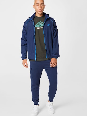 Nike Sportswear Tapered Gargohousut 'Club' värissä sininen