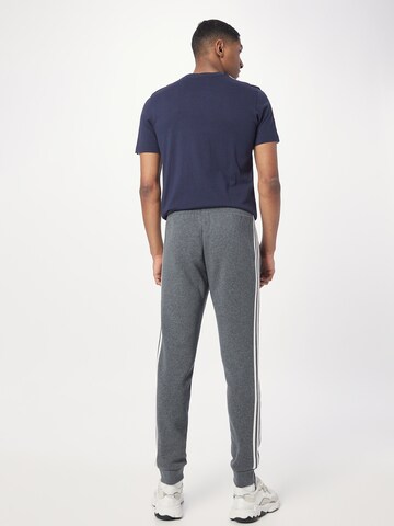 ADIDAS SPORTSWEAR - Tapered Pantalón deportivo 'Essentials' en gris