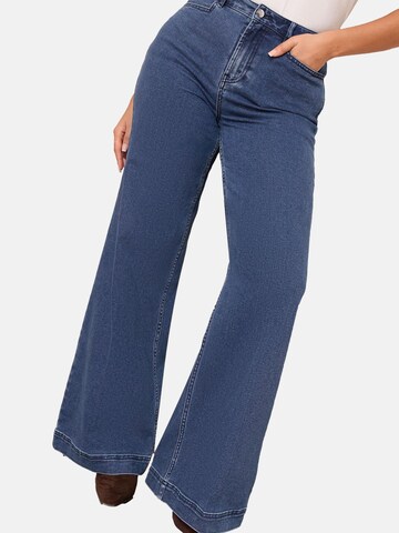 zils Friends Like These Plati gali Džinsi: no priekšpuses