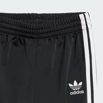 ADIDAS ORIGINALS Jogging ruhák 'Adicolor Firebird' - fekete