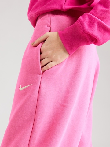 Nike SportswearTapered Hlače 'PHOENIX FLEECE' - roza boja