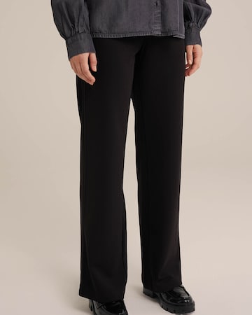 WE Fashion Loose fit Trousers in Black: front