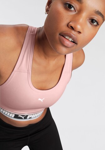 Bustino Reggiseno sportivo di PUMA in rosa