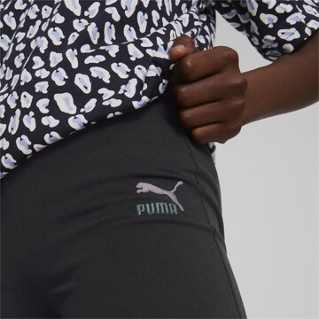 PUMA جينز ذات سيقان واسعة سراويل ضيقة بلون أسود