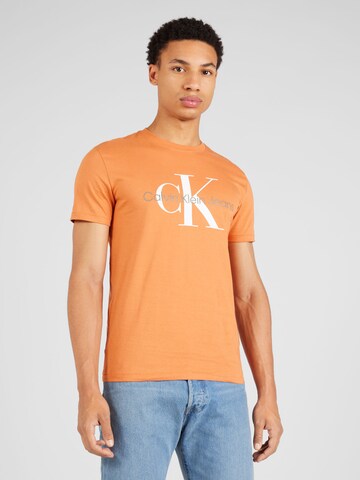 Calvin Klein Jeans Koszulka w kolorze pomarańczowy: przód