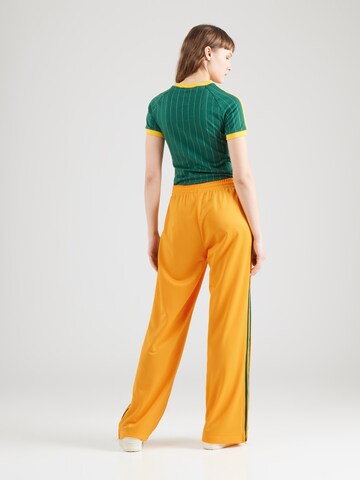 ADIDAS ORIGINALSWide Leg/ Široke nogavice Sportske hlače 'Adicolor Classic Firebird' - narančasta boja