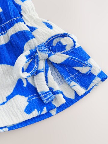 Set Next en bleu